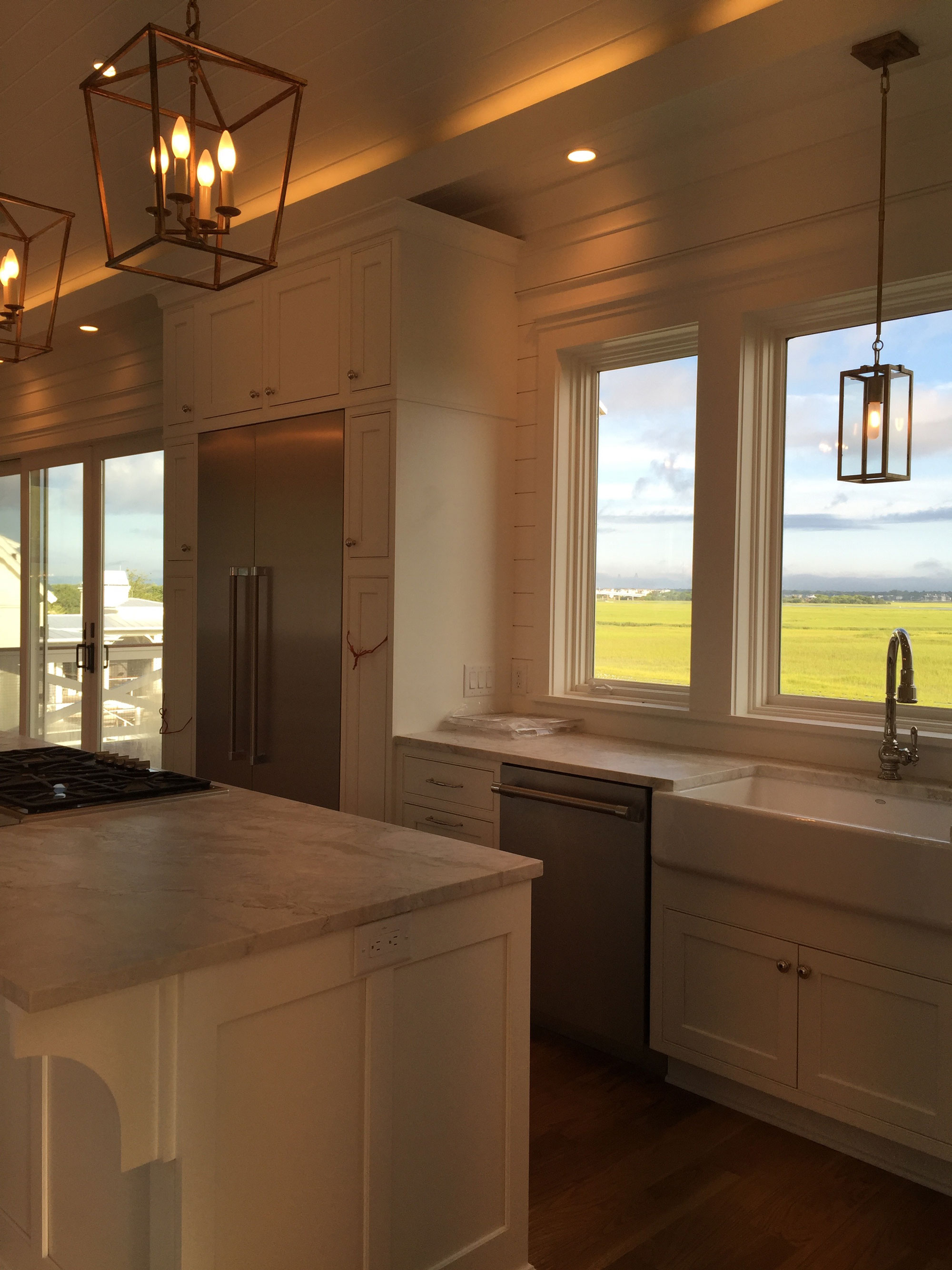 Kitchen with wall of windows to marsh view
