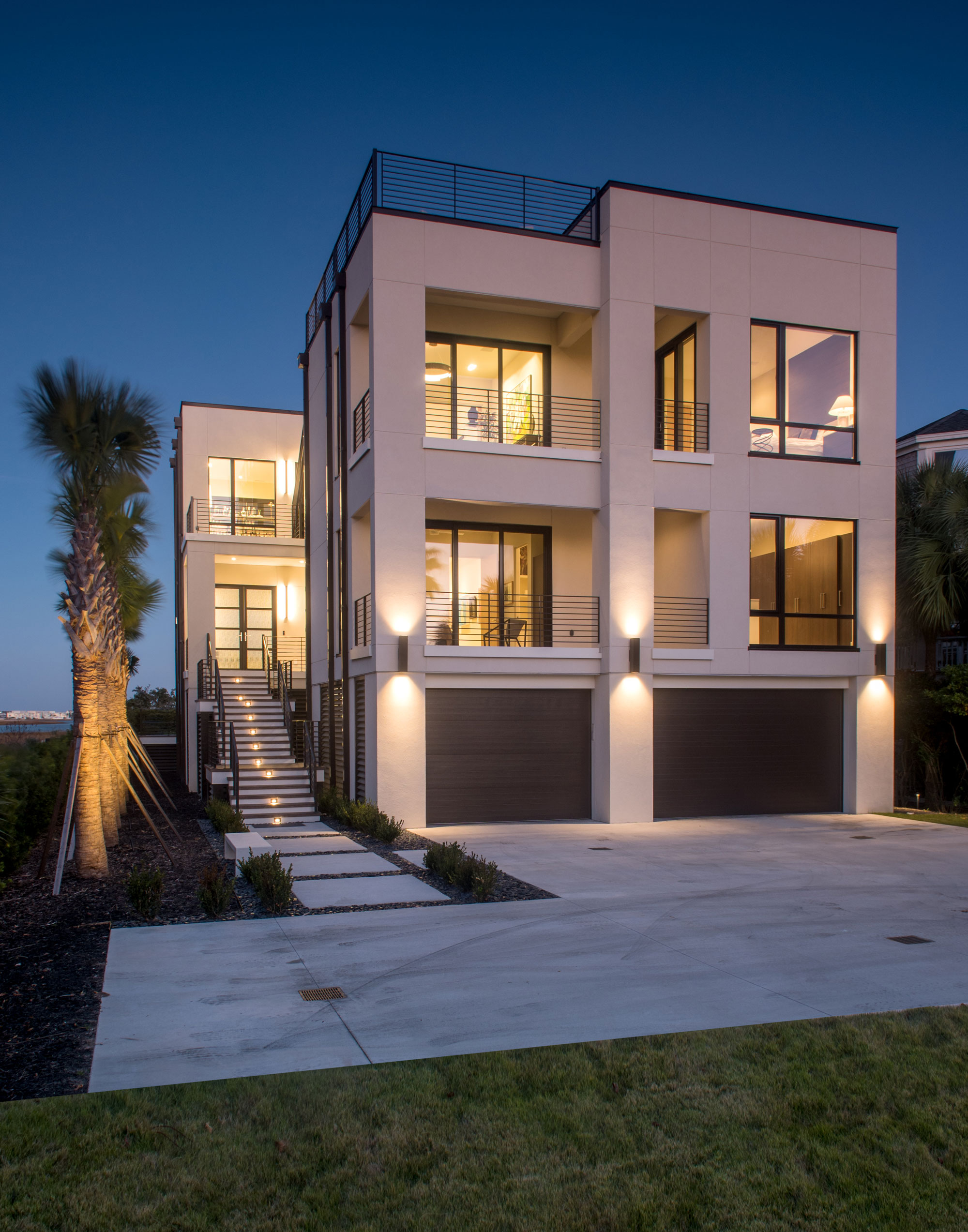 Night view of the front exterior of new home on Sullivan's Island