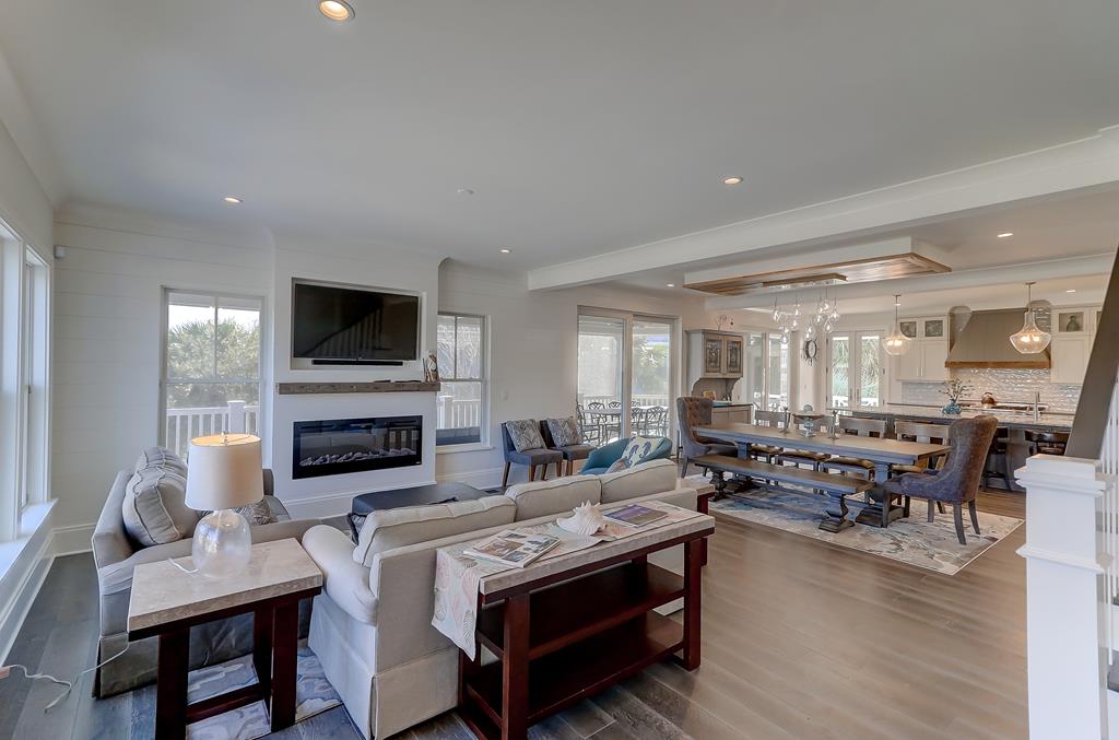 Walls removed in dated contemporary beack home to create open plan living with coastal luxury