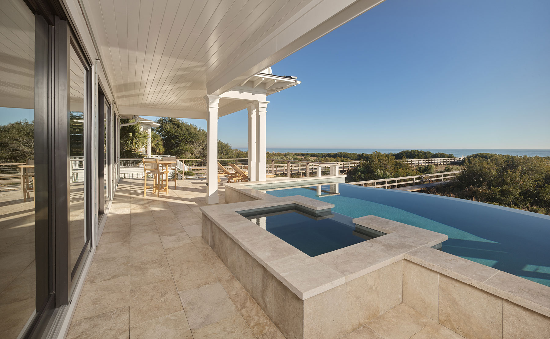 Outdoor living with infinity edge pool. Ocean front in Isle of Palms