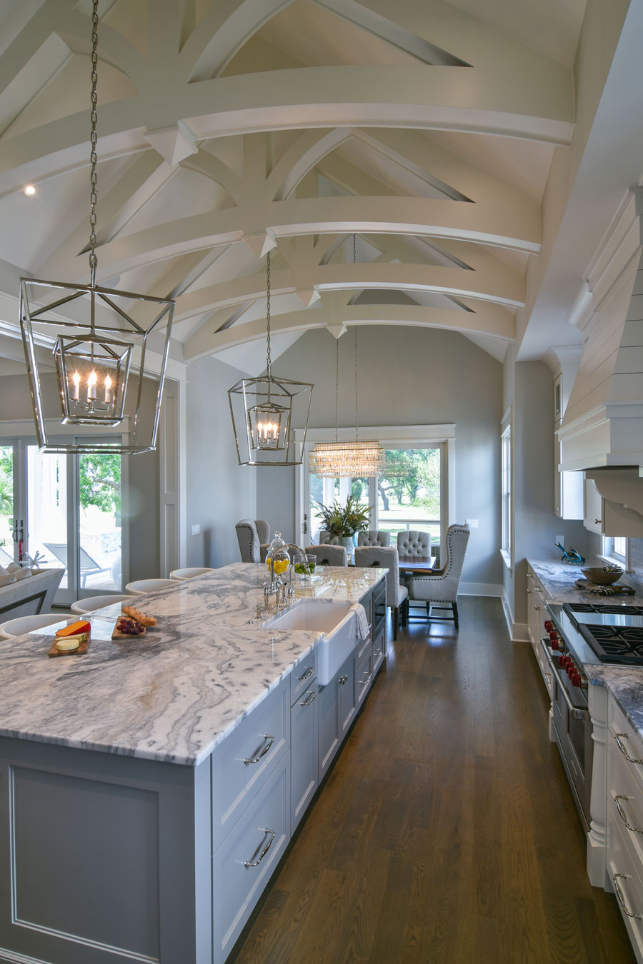 White and gray kitchen with extensive truss work, cathedral ceiling