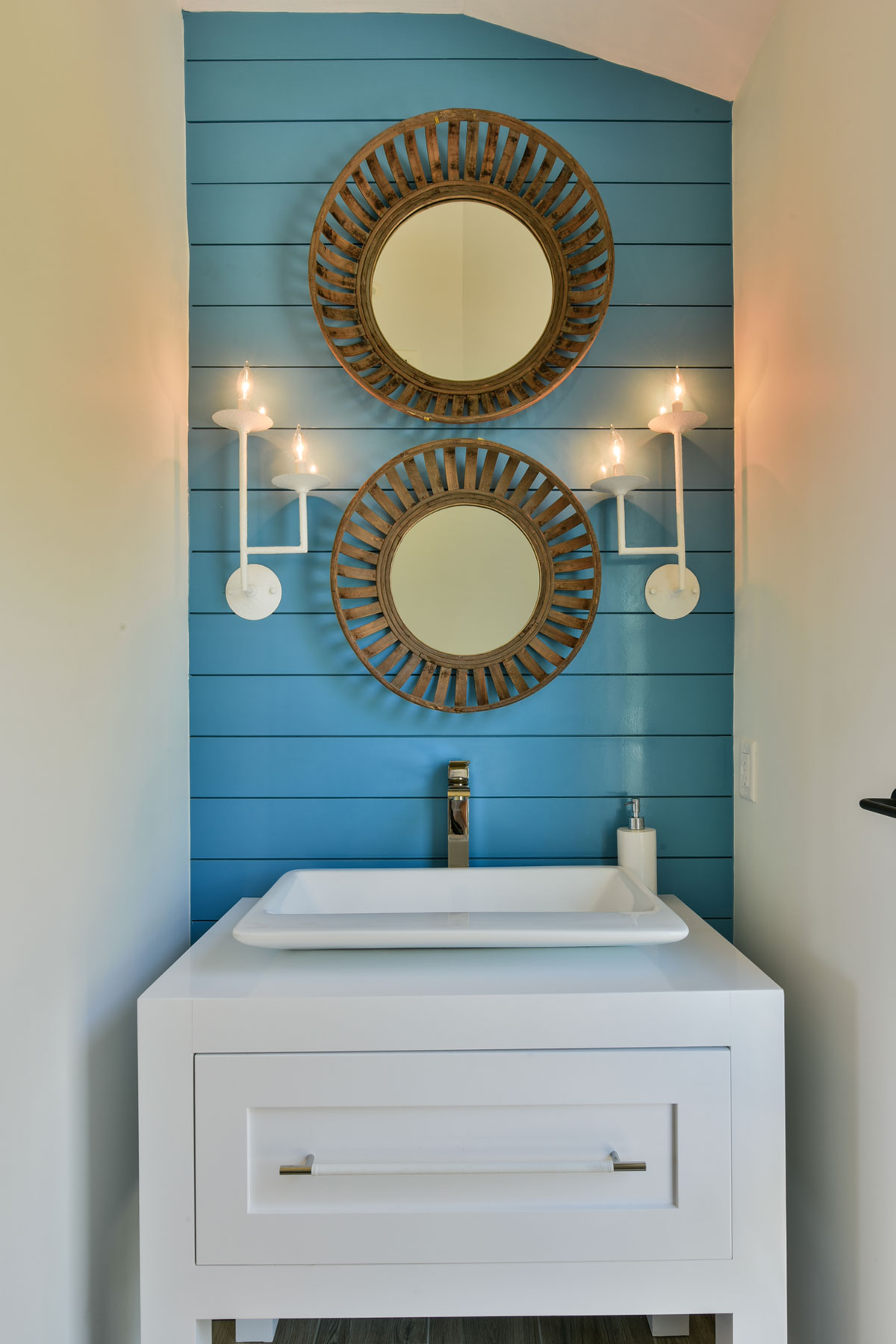 Powder room vanity with blue shiplap walls