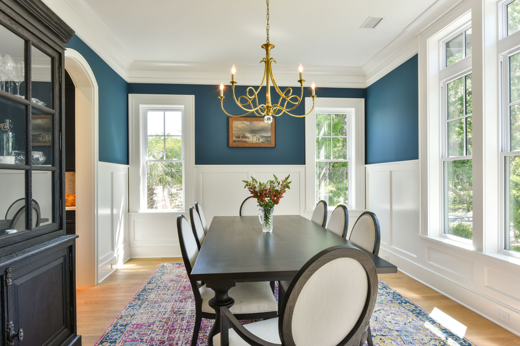 Formal dining room with white board and batten and blue painted walls