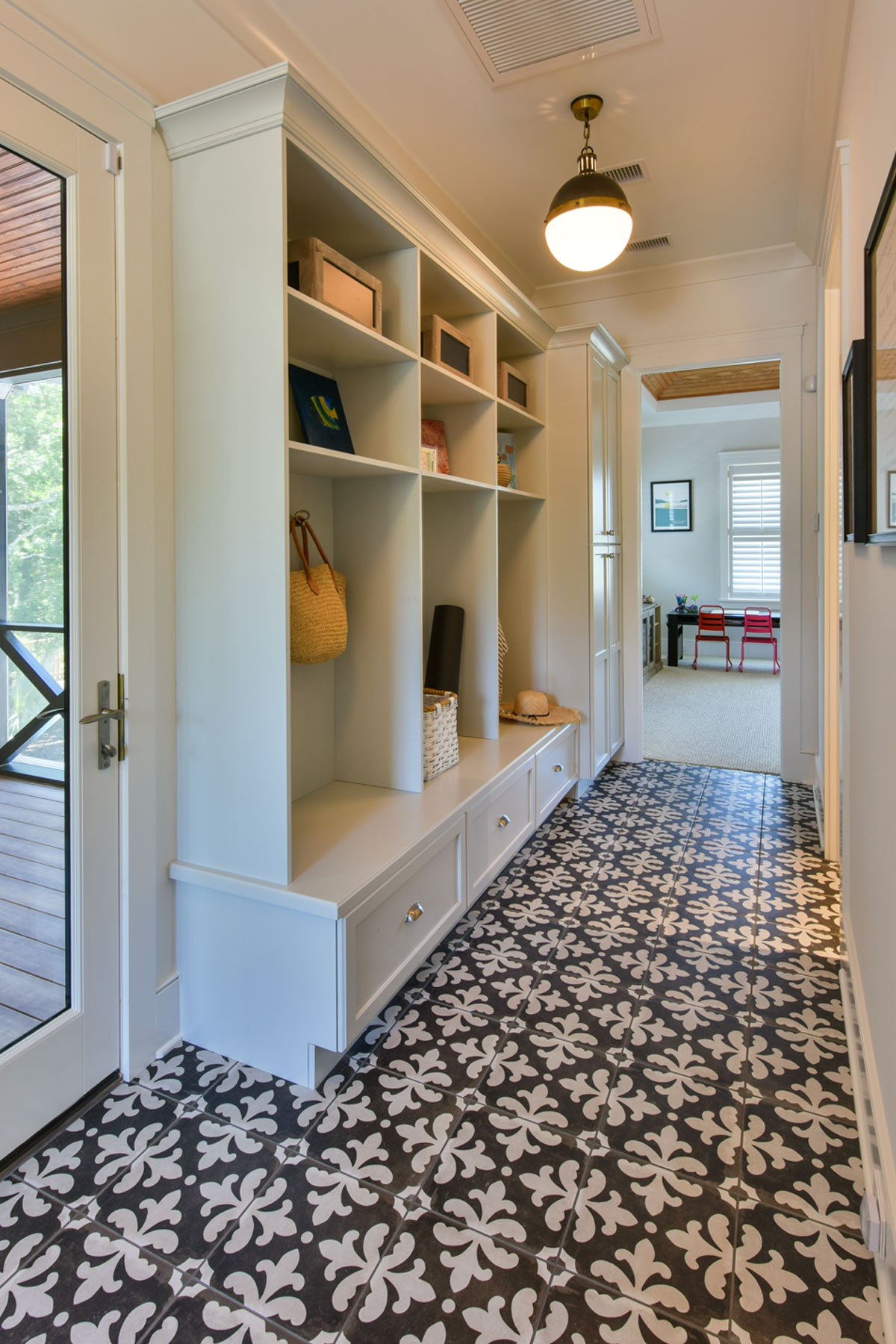 Mudroom with patterned tile floor
