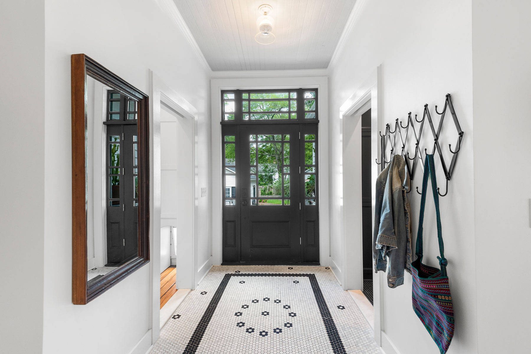 Back hall mudroom with penny tile detail