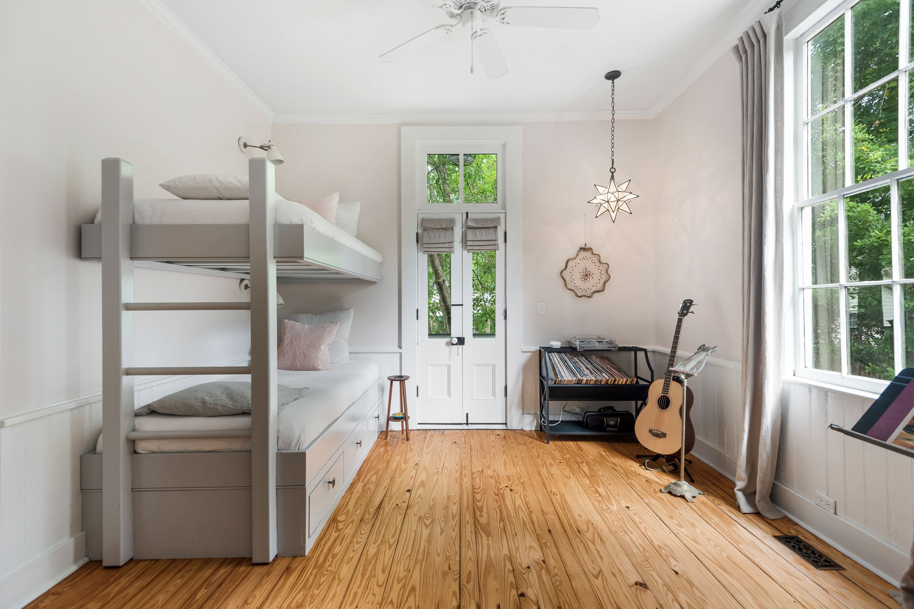 Secondary child's bedroom with bunk bed and high ceilings