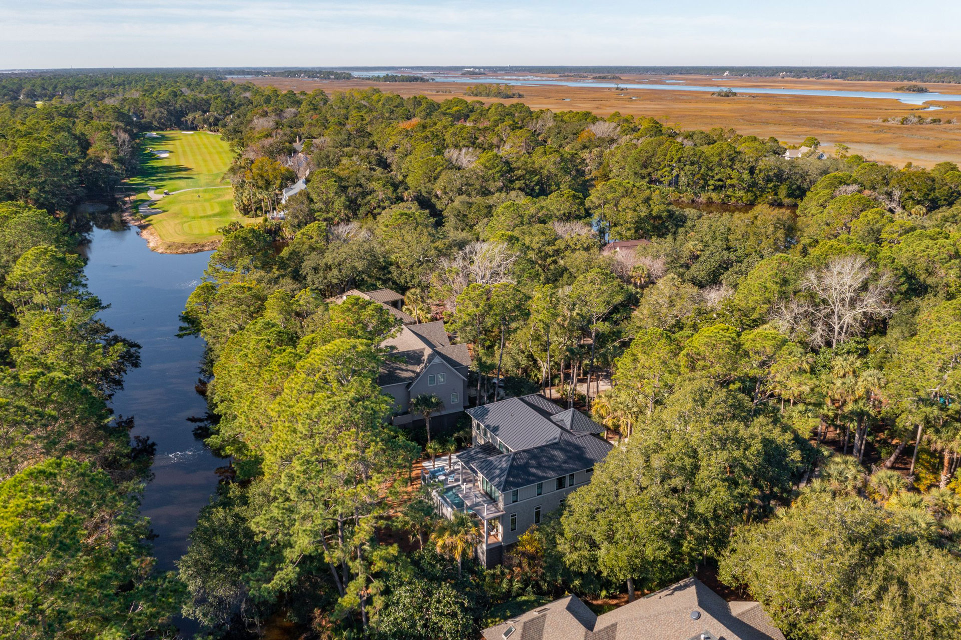 Aerial view showing new construction home near the marsh and Osprey Point Golf Course