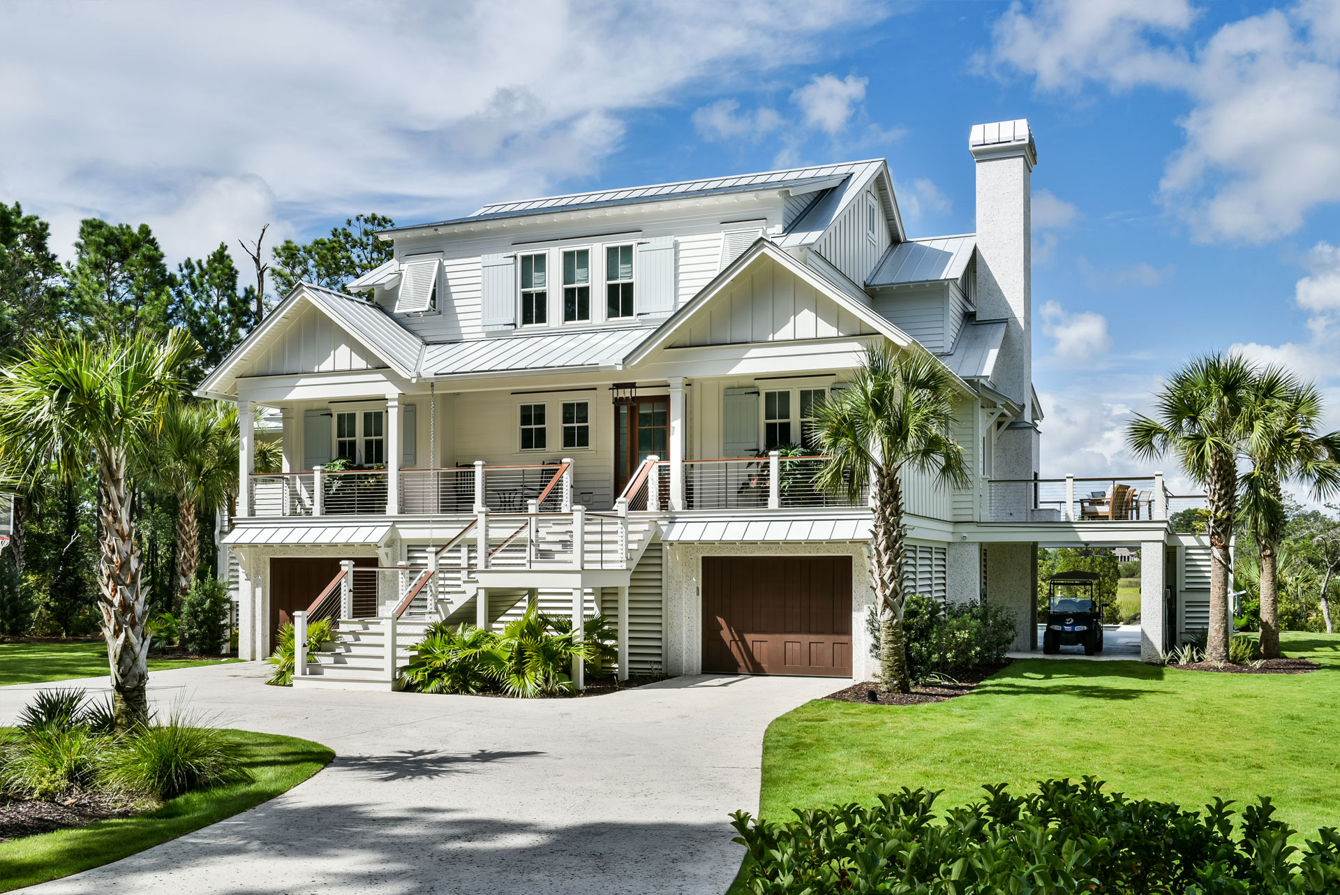 Modern, coastal, luxury home--elevated with porches sophisticated roof line