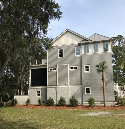 Side view including back porch of new custom home in Seabrook Village