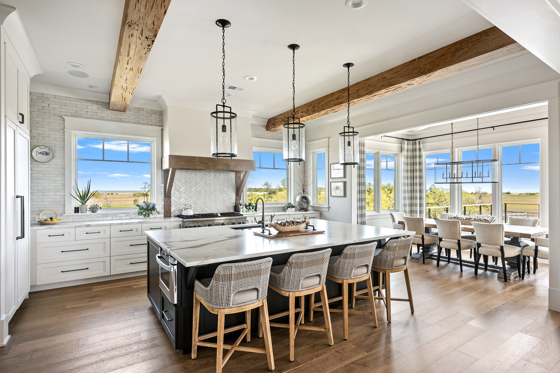 Show Gathering Kitchen in new construction home with 180 degree marsh and ocean views