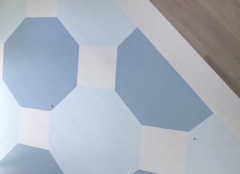 Detail of painted wood floor with hexagon detail