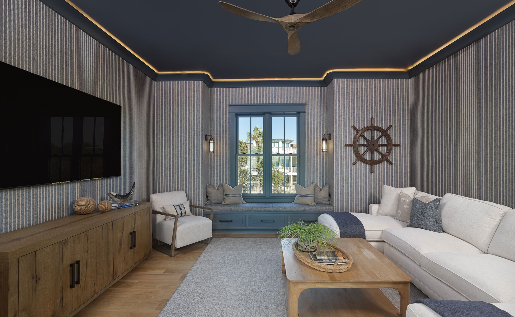 Nautical blue, modern take in TV room of luxury coastal home