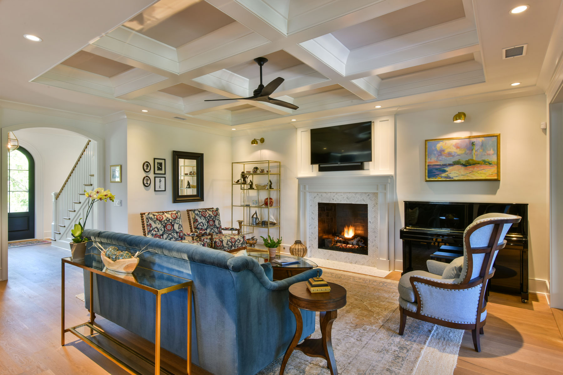 Formal den with fireplace and coffered ceiling