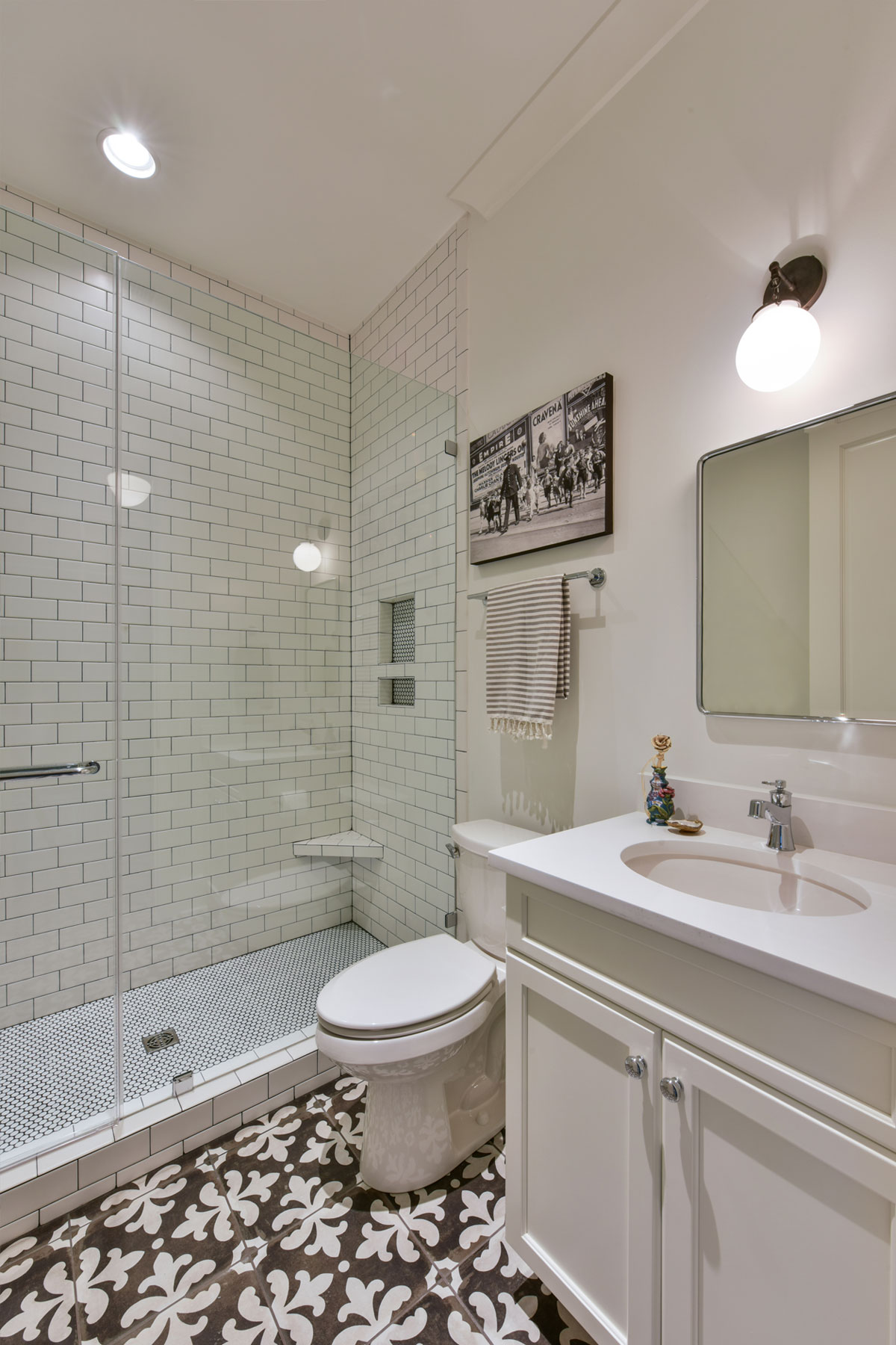 Guest bath white subway tile, patterned floor