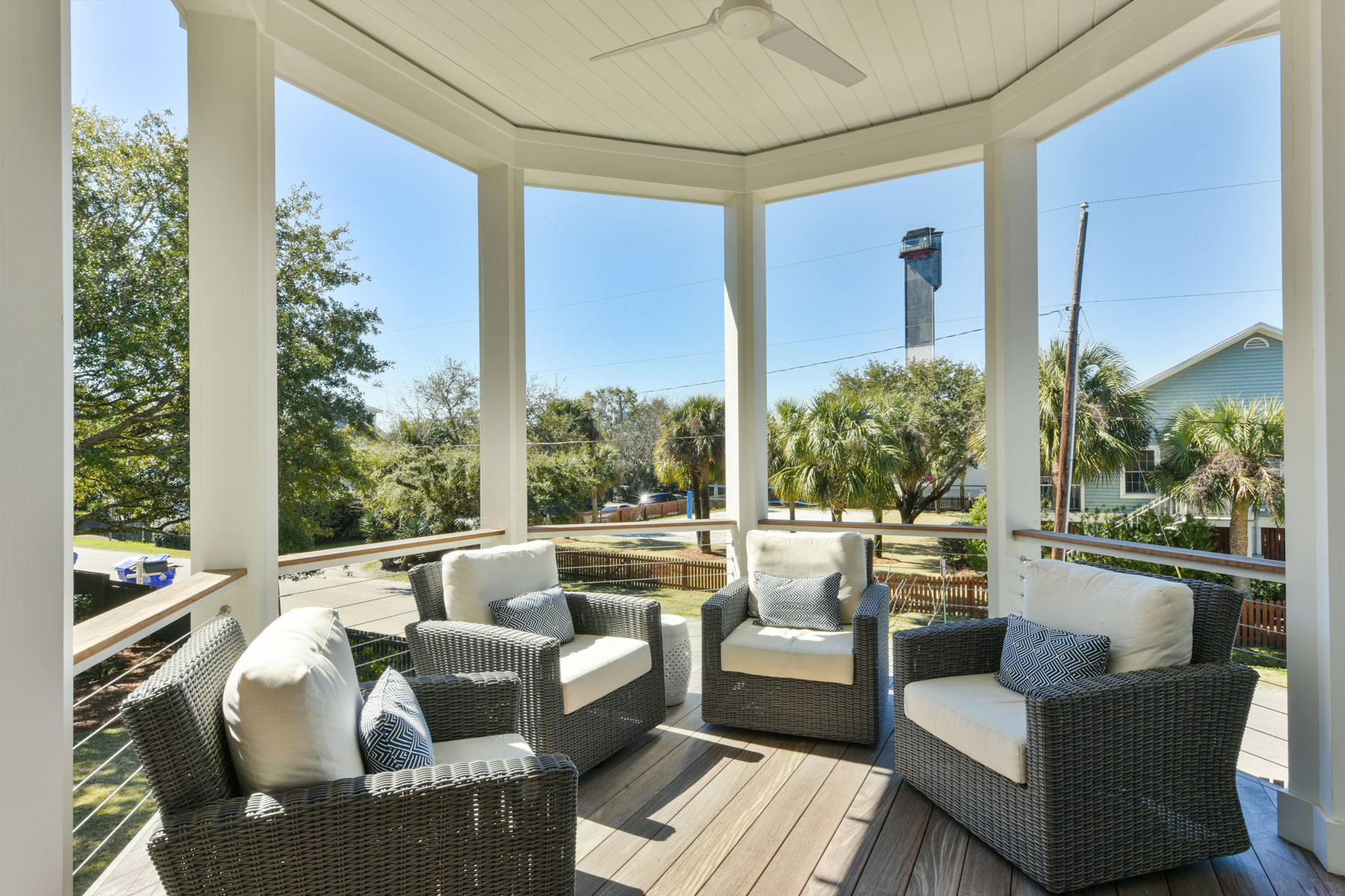 Octagonal front porch bump out on wrap around deck with view of the Charleston Lighthouse