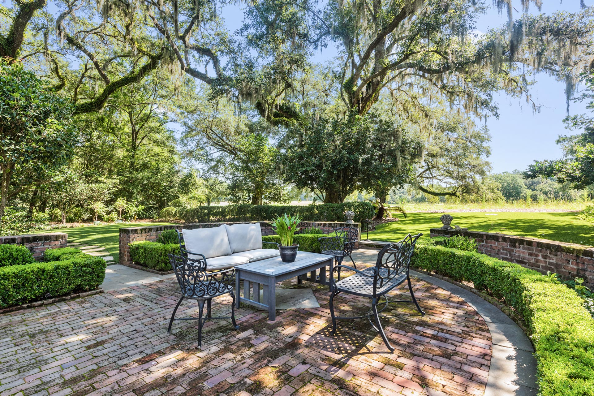 Brick patio in garden for outdoor seating on the South Carolina live oaks