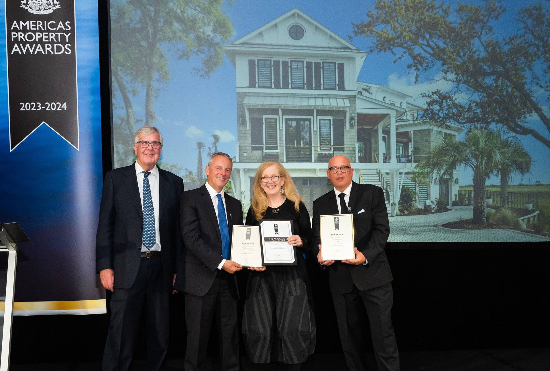 Rachel Burton of Swallowtail Architecture receives award for 2023-2024 Best Architecture in the USA from The presenters of the awards on the evening were: IPA Operations Director Paul Wright, UK's Lord Waverley and Canadian Senator David Wells