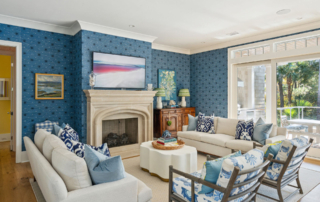 Bold blue wallpaper paired with bold fabric prints in blue, yellow, green, and white in new home on Kiawah Island designed by Swallowtail Architecture