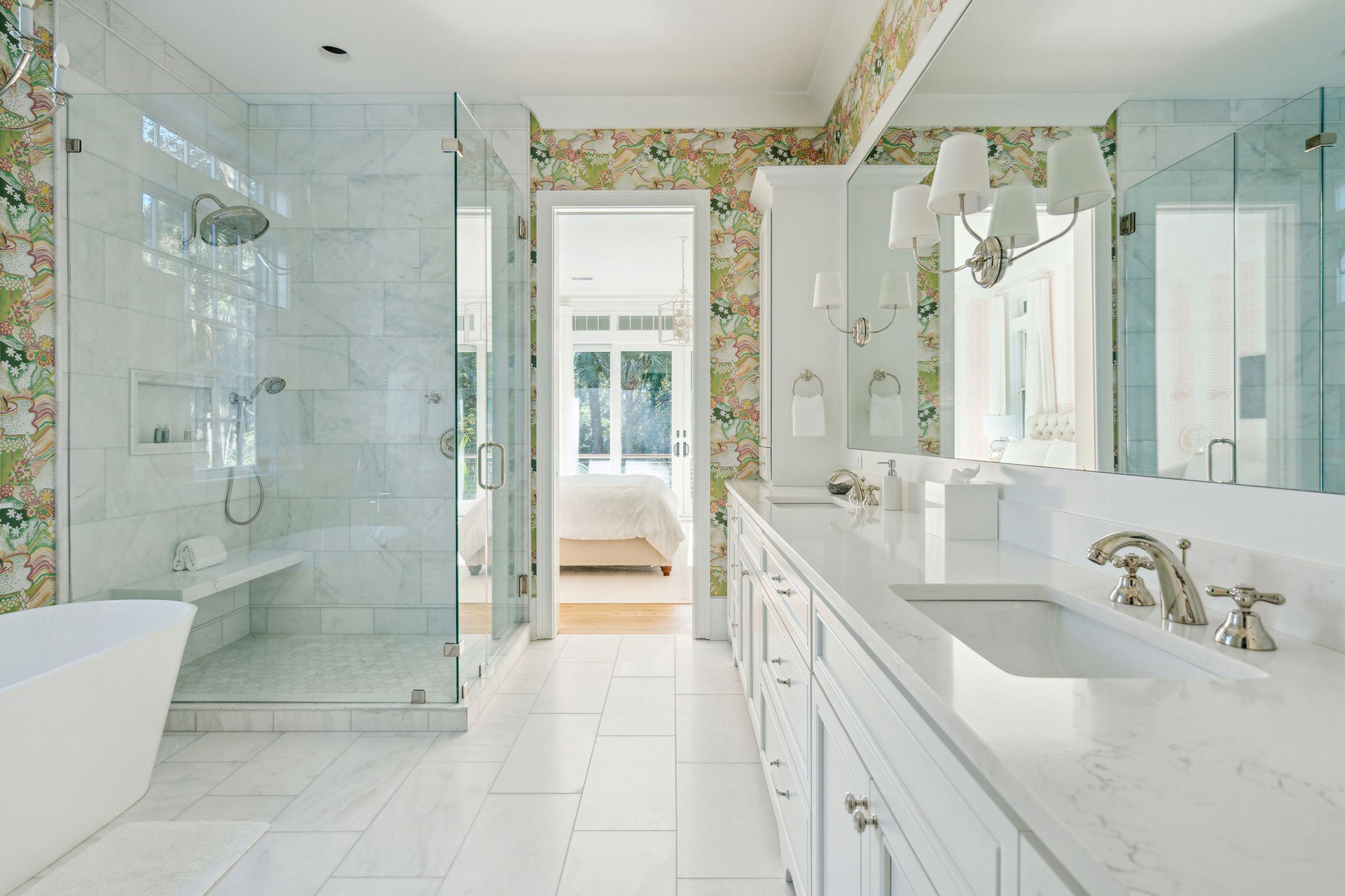 Classic, coastal bathroom with marble shower, separate tub, double custom vanity