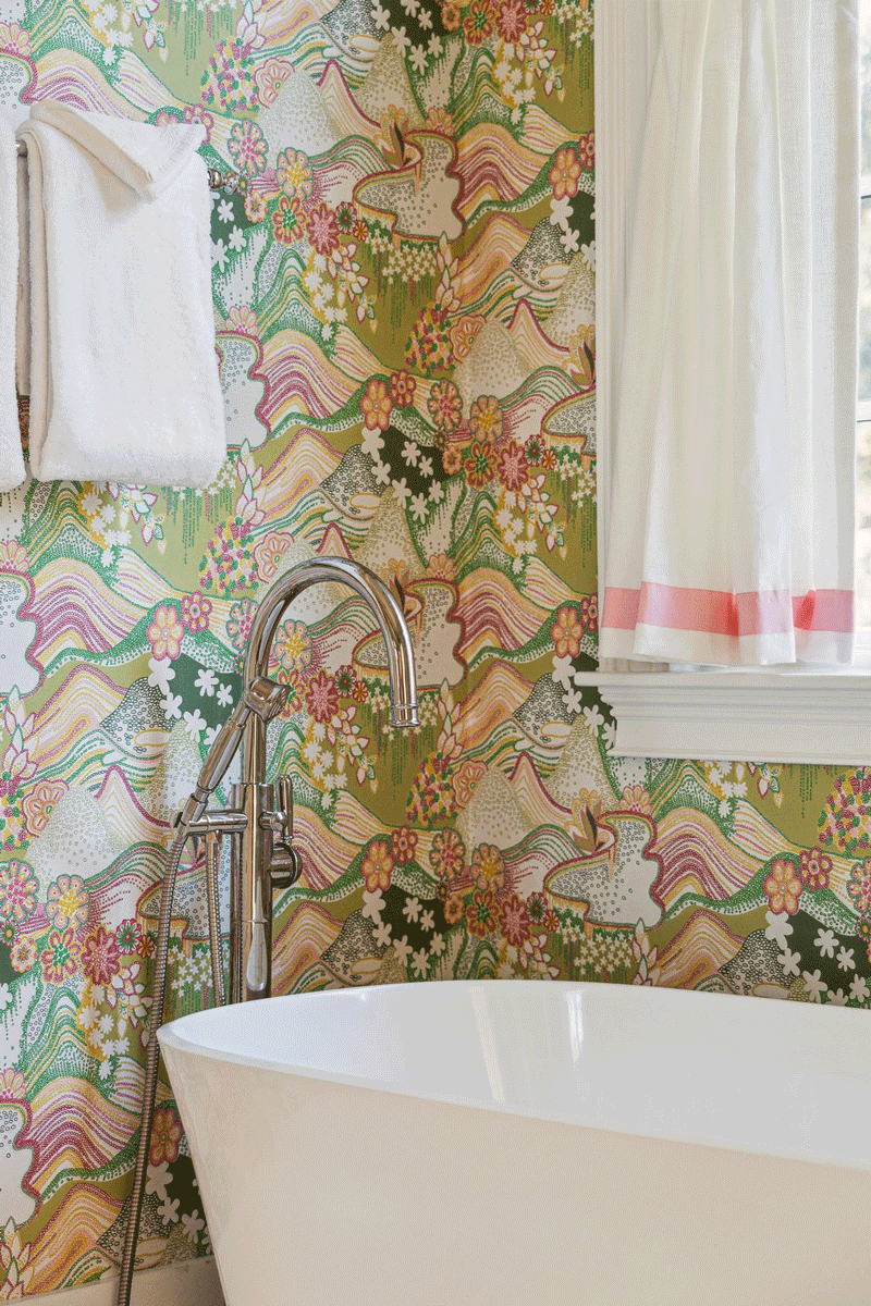 Modern wallpaper design in bathroom with green, pink, creams, and black